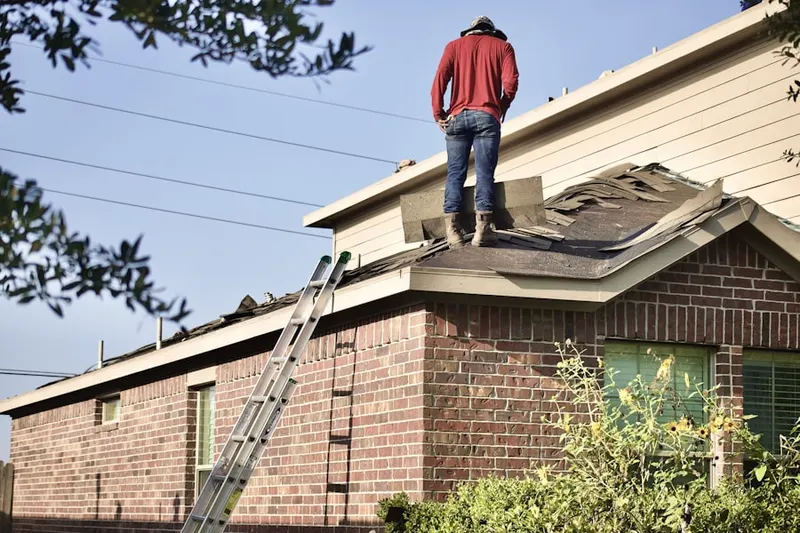 Professional roofer working on a residential roof in Rancho San Diego